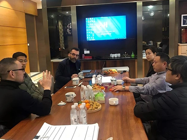 Company leaders meeting with overseas clients